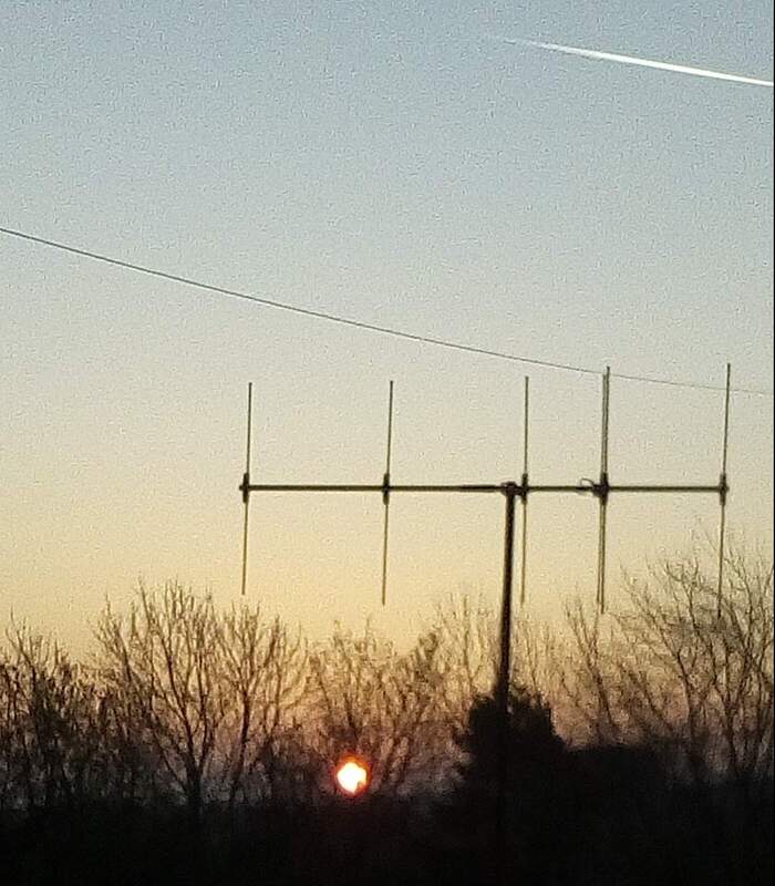 Homebrew 5 element Yagi-Uda array for VHF 2m band. with sun creeping up through the trees on a cold winters morning.